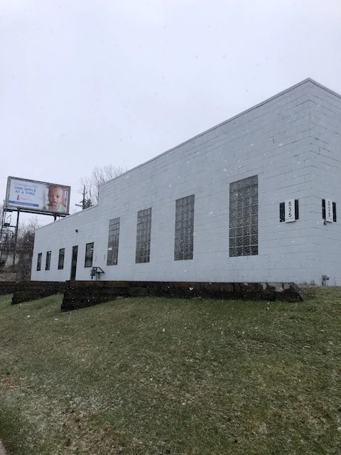 Commercial block building exterior before stucco renovation