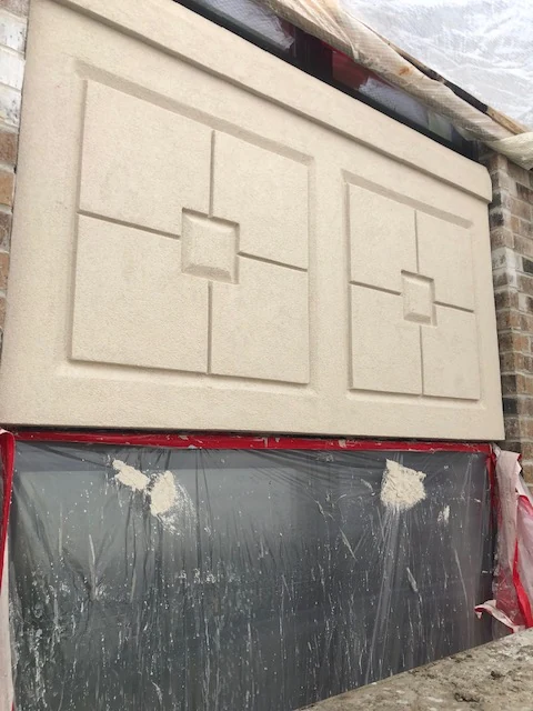 Synthetic stucco with cast stone geometric panel design