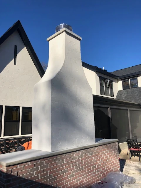 White smooth stucco chimney on a custom home